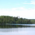 Купаюсь. Вода в озере чистая, но прохладная. С берега красивый вид на Голгофо-Распятский скит.  